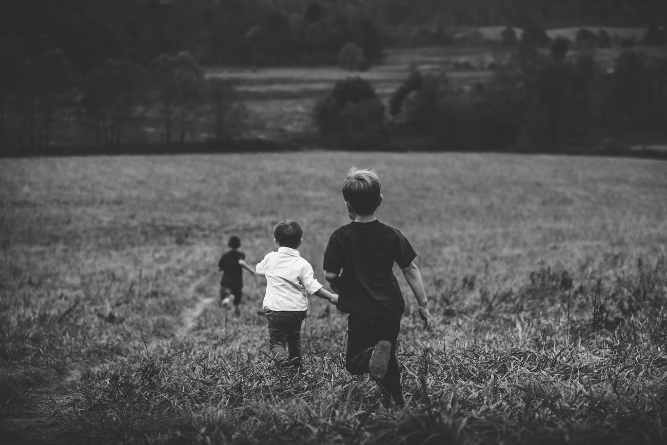 Children running through a field