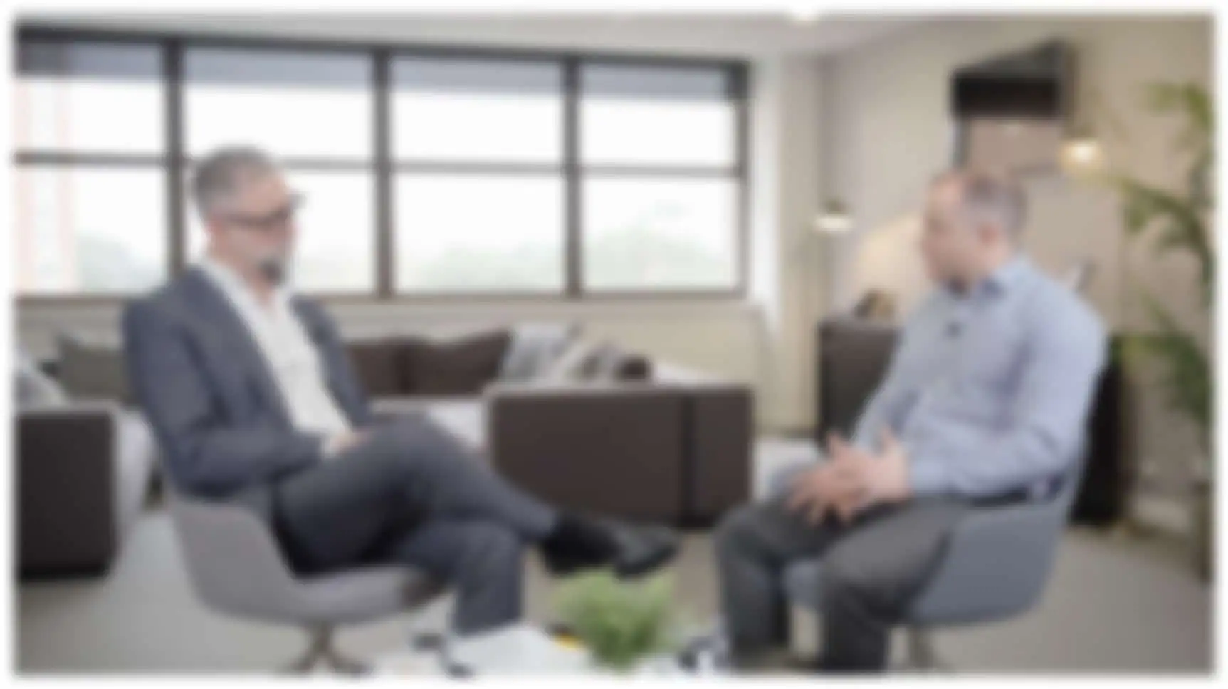 Blurred Image of Solicitor and Client Talking