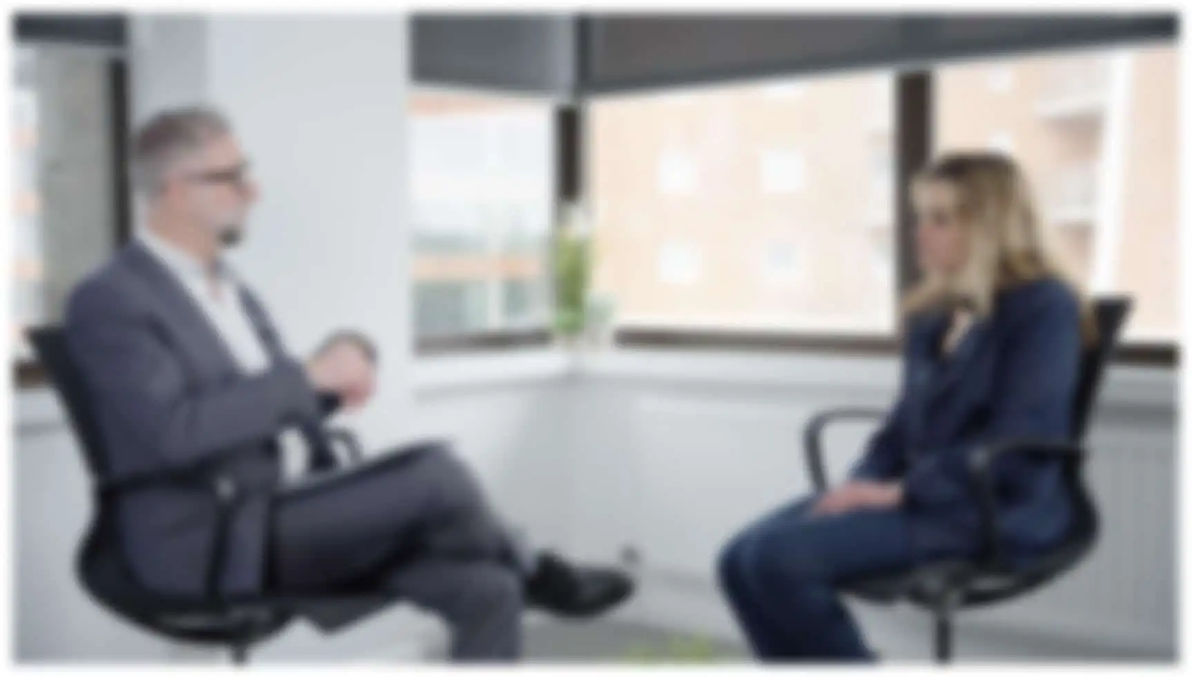 Blurred Image of Two Solicitors Talking