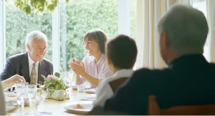 Family sitting around a dinner table
